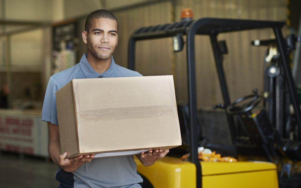 Delivery man picks up packages